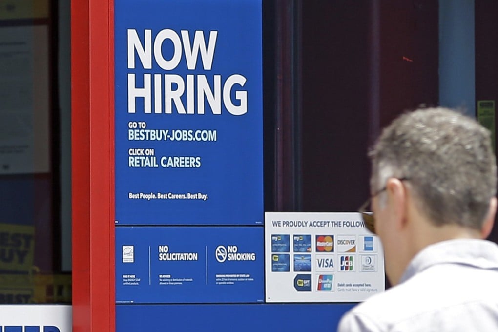 In this Monday, May 22, 2017, photo, a "Now Hiring" sign welcomes a customer entering a Best Buy store in Hialeah, Fla. Photo: AP Photo/Alan Diaz