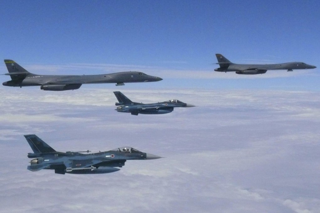 Japanese fighter jets fly with the US Air Force B-1B Lancer bombers over Japan's southern island of Kyushu during their joint exercise. Photo: AP