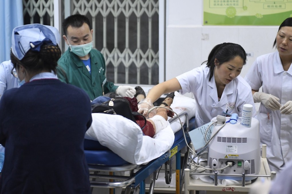 One of the people injured in the Sichuan earthquake receives medical treatment at the People's Hospital in Jiuzhaigou yesterday. Photo: Xinhua