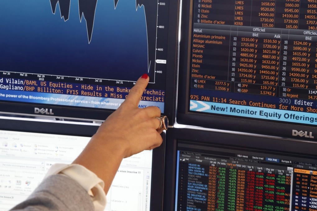 A fund manager shows a graph displaying activities of shares on the French Stock Exchange, in a financial analysis office in Paris, France, Tuesday, Aug. 25, 2015. Chinese stocks fell Tuesday for a fourth day, hitting an eight-month low amid signs Beijing was no longer buying shares to stem a price slide, and Japanese stocks also dropped. But other Asian and European markets bounced back from a day of heavy losses.(AP Photo/Francois Mori)