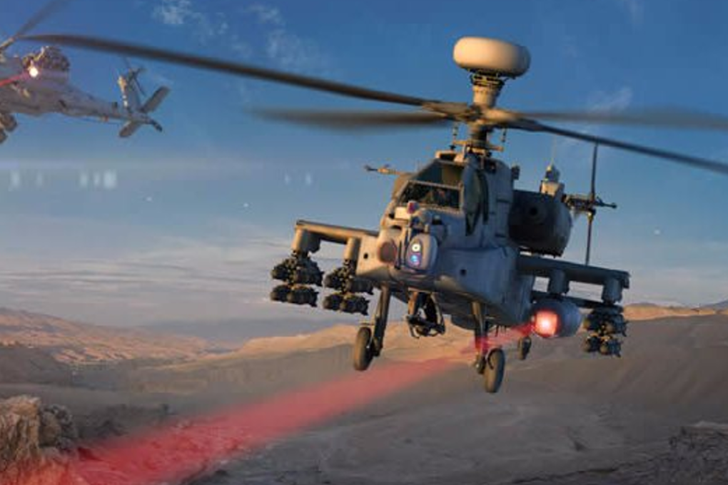 An Apache helicopter firing a laser weapon. Photo: Raytheon