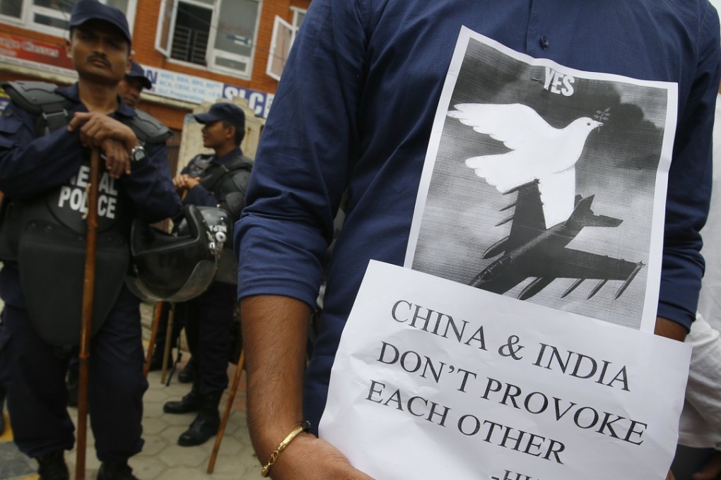 A Nepalese human rights activist holds a placard during a protest at the Chinese embassy in Kathmandu. Photo: EPA