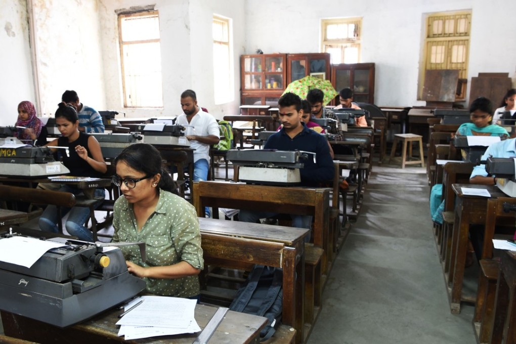 Candidates appear for the last official typing exam conducted by the state government in Mumbai. Photo: AFP