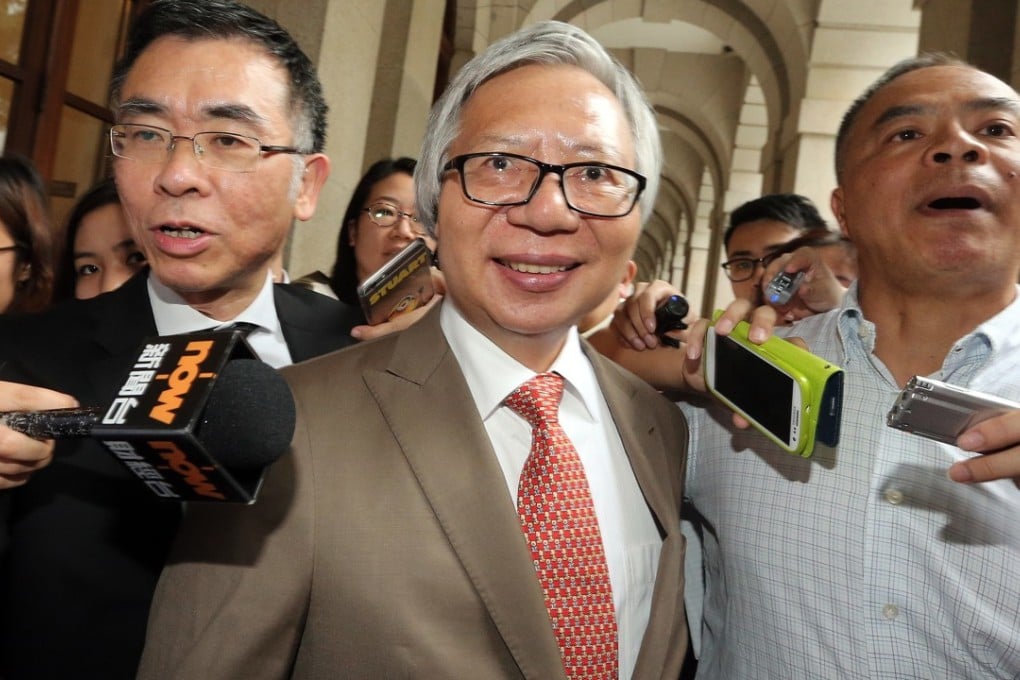 Former Sun Hung Kai Properties co-chairman Thomas Kwok (centre) is all smiles after being released on bail in July last year. Picture: SCMP