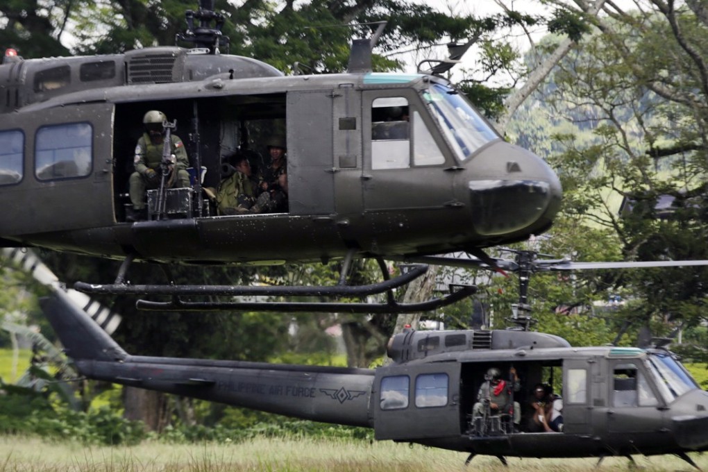 Philippine Air Force helicopters land on the fifth day of fighting in Marawi City, Mindanao island, southern Philippines. Photo: EPA
