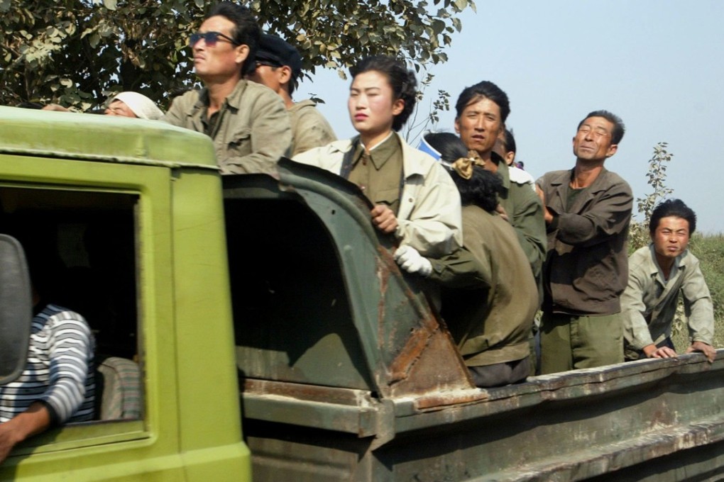 A group of North Korean farm labourers and soldiers in a truck driving along a country road in the northwestern part of the country. Photo: SCMP Pictures