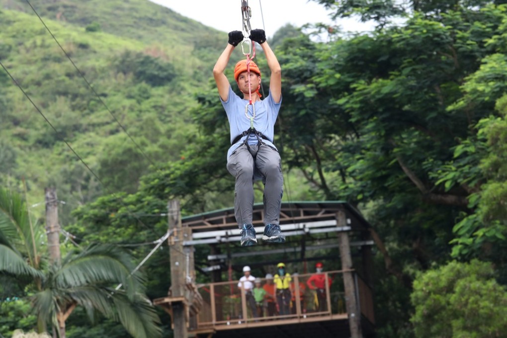 A youngster takes to the zipline at the training camp in Pat Heung. Photo: Nora Tam