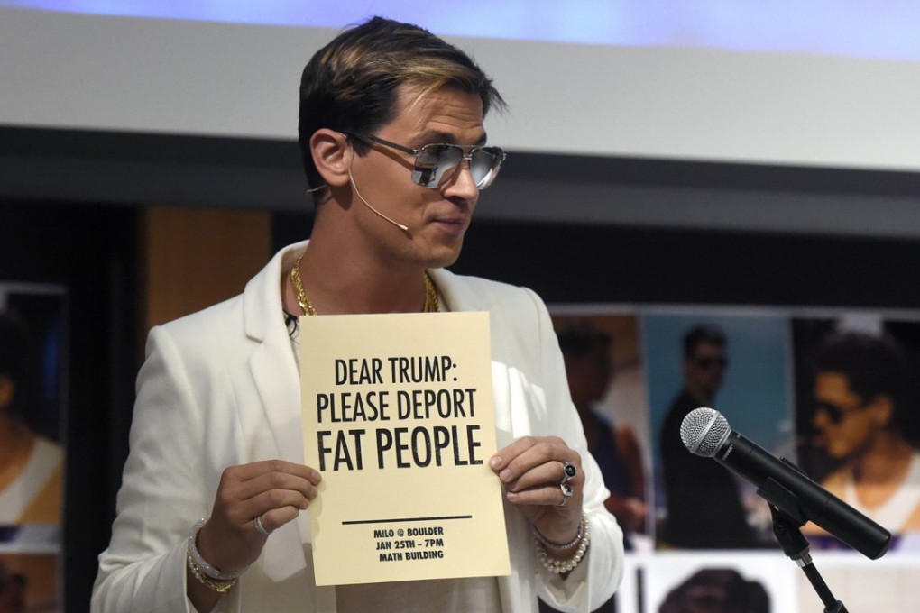 Milo Yiannopoulos holds a sign as he speaks at the University of Colorado campus in Boulder, Colorado on January 25. Photo: AP