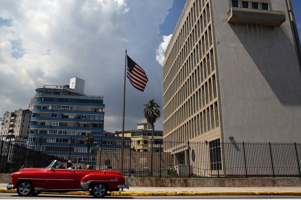 A classic car passes in front of the US embassy in Havana, Cuba. Photo: EPA