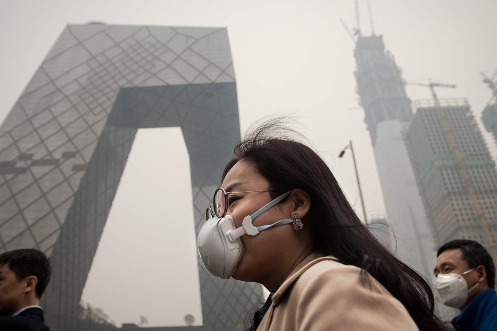 A woman wearing a protective pollution mask on a street in Beijing. Photo: AFP
