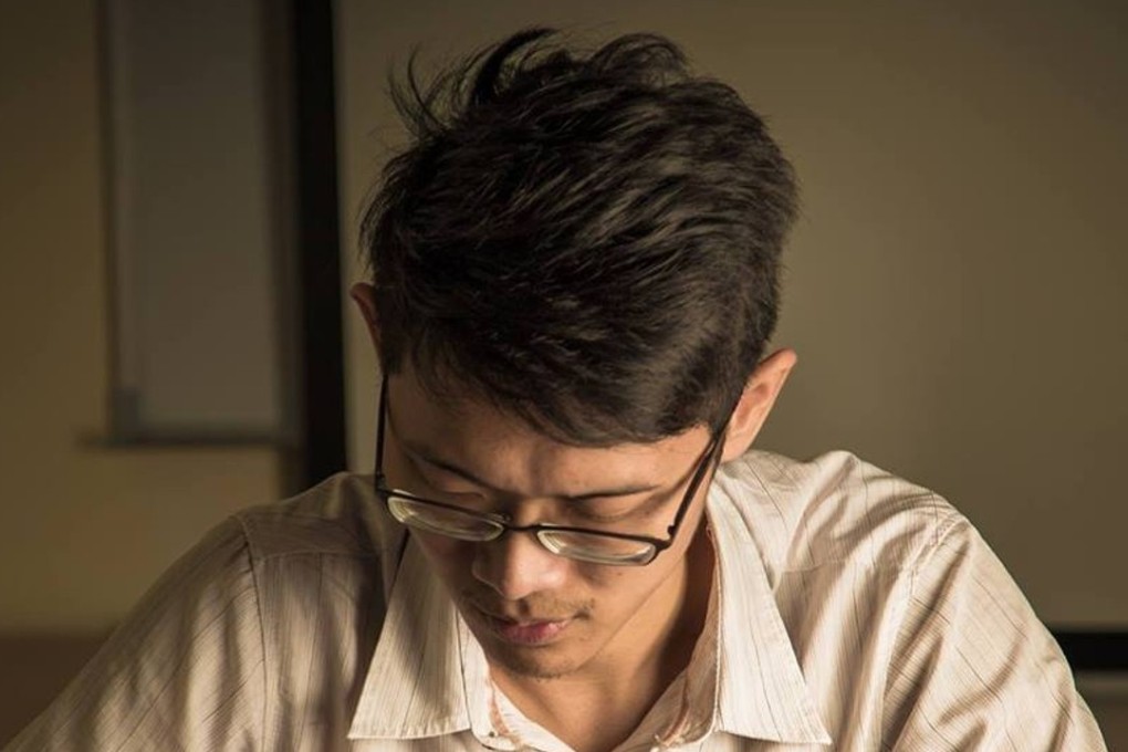 Ye Ye concentrates on writing Chinese characters in a style far removed from that of his school days. Photo: Handout