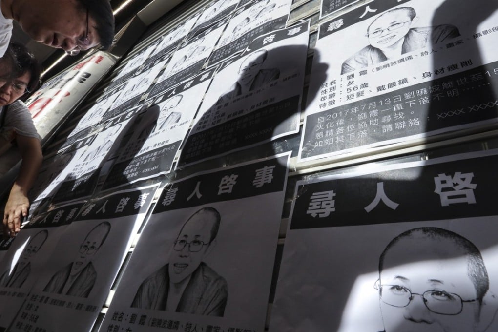 Missing person notices posted on a wall in Mong Kok. Photo: Felix Wong