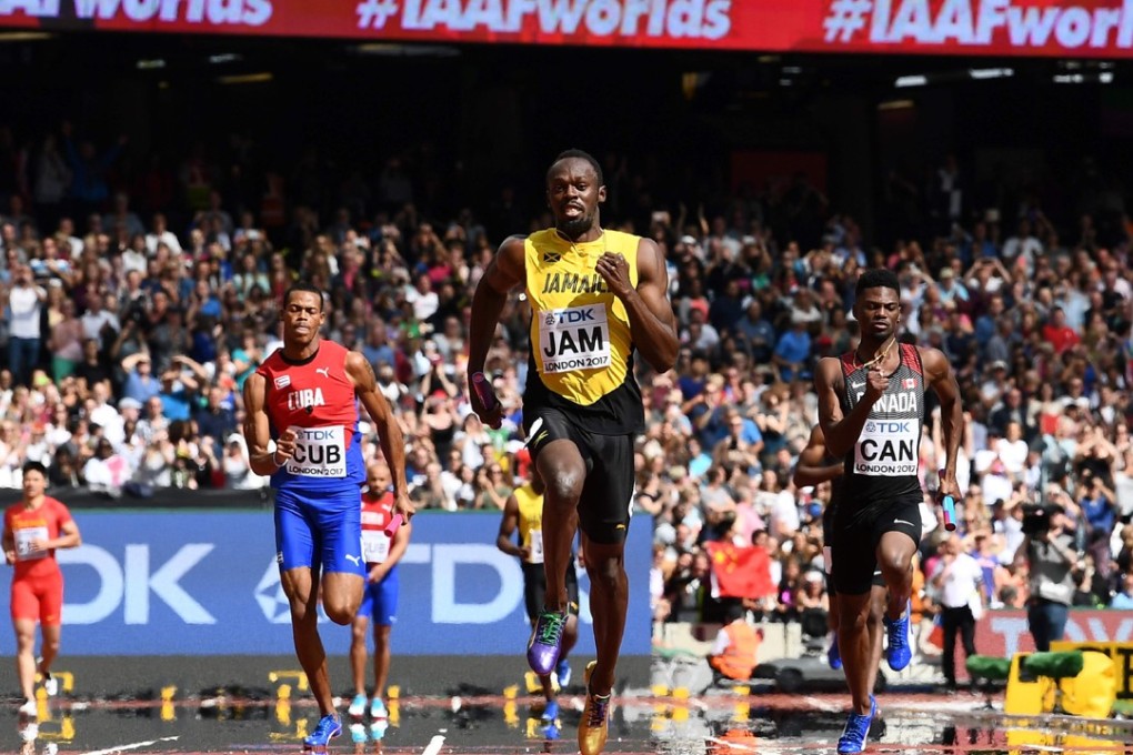 Jamaica's Usain Bolt (centre) races to the finish line on the anchor leg ahead of Canada's Mobolade Ajomale (right) and Cuba's Jose Luis Gaspar (left) to win their heat in the men's 4x100m relay. Photo: AFP