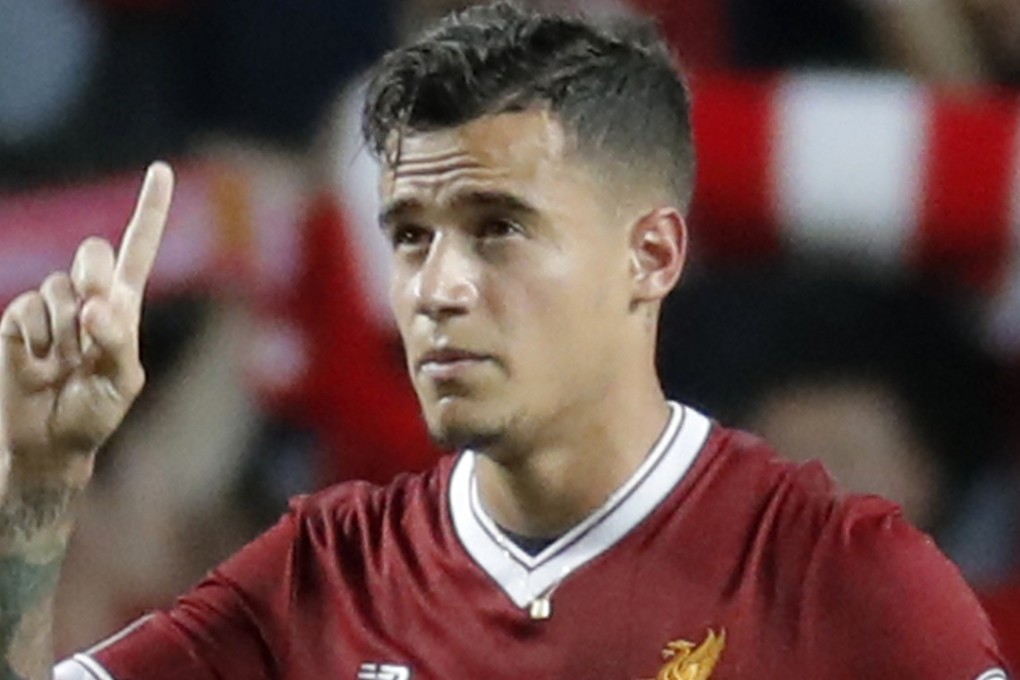 Philippe Coutinho celebrates after scoring against Leicester at the Premier League Asia Trophy in Hong Kong. Photo: AP