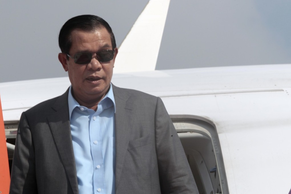 Cambodian Prime Minister Hun Sen exits the plane as his arrives from Laos in Phnom Penh, Cambodia. Photo: AP