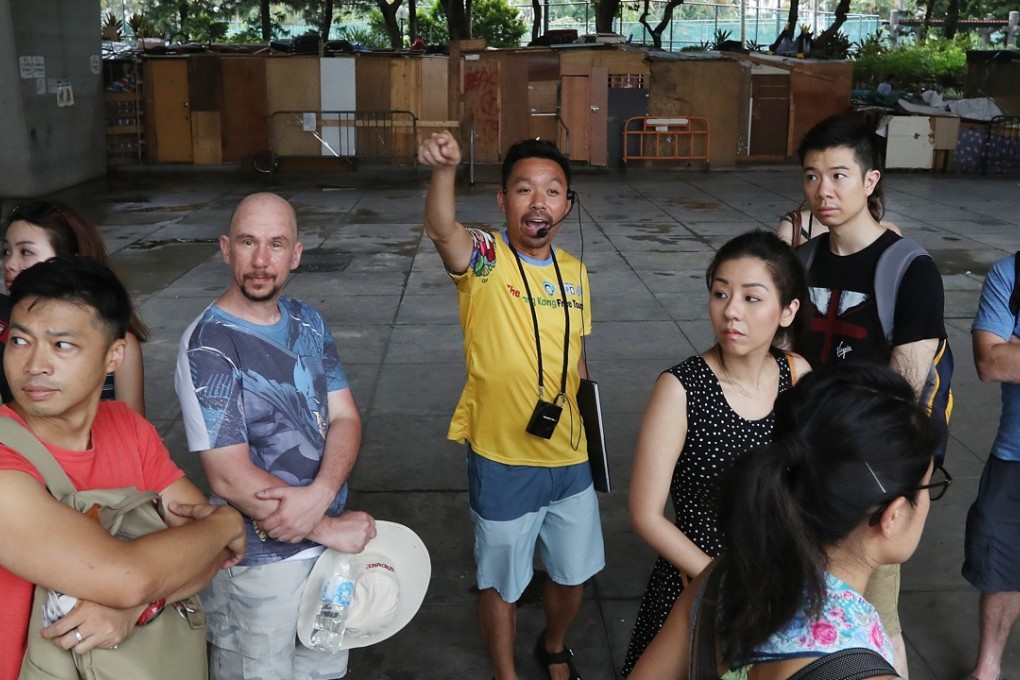 Michael Tsang Chi-fai (centre) of Hong Kong Free Tours, leads a group to the Tung Chau Street Temporary Market. Photo: Nora Tam