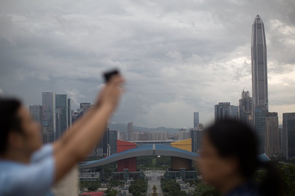 People visit a panoramic lookout in Shenzhen, China. Photo: EPA