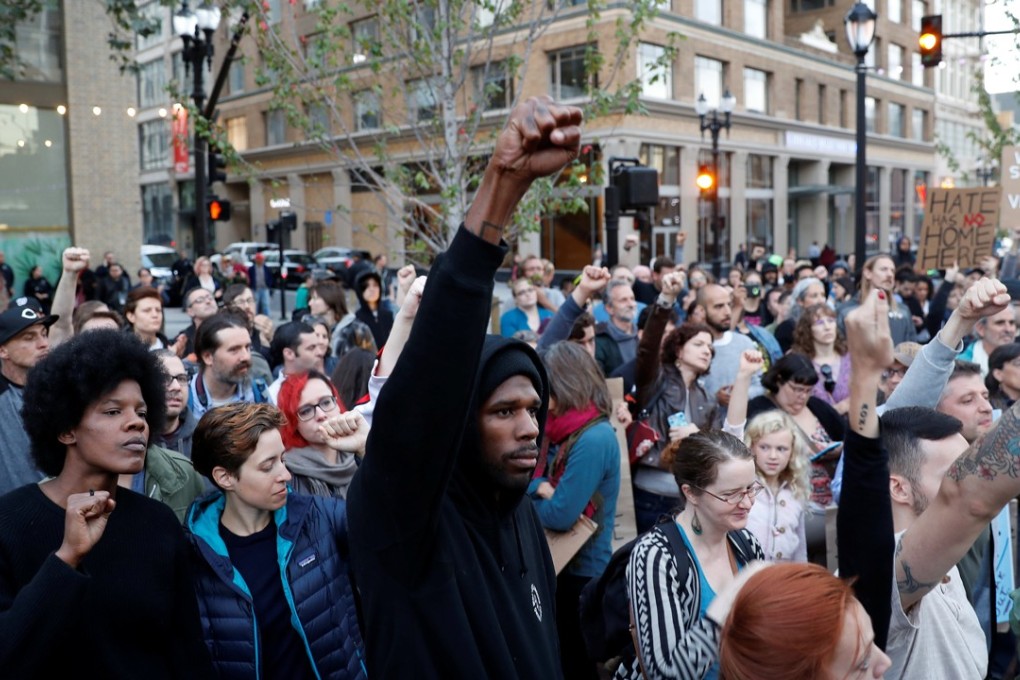 Demonstrators gather in Oakland, California, in response to the Charlottesville violence that erupted at the “Unite the Right” rally organised by white nationalists. Photo: Reuters