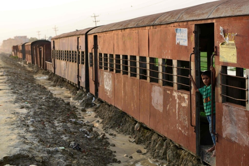 A Nepali child plays in an abandoned railway carriage of the Nepal Railway Corporation in Janakpur, some 300km south of Kathmandu. Photo: AFP