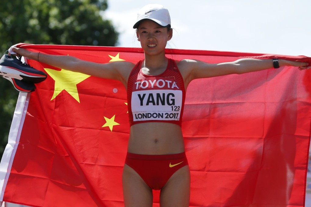 China's Yang Jiayu poses after winning the women's 20km race walk athletics. Photo: