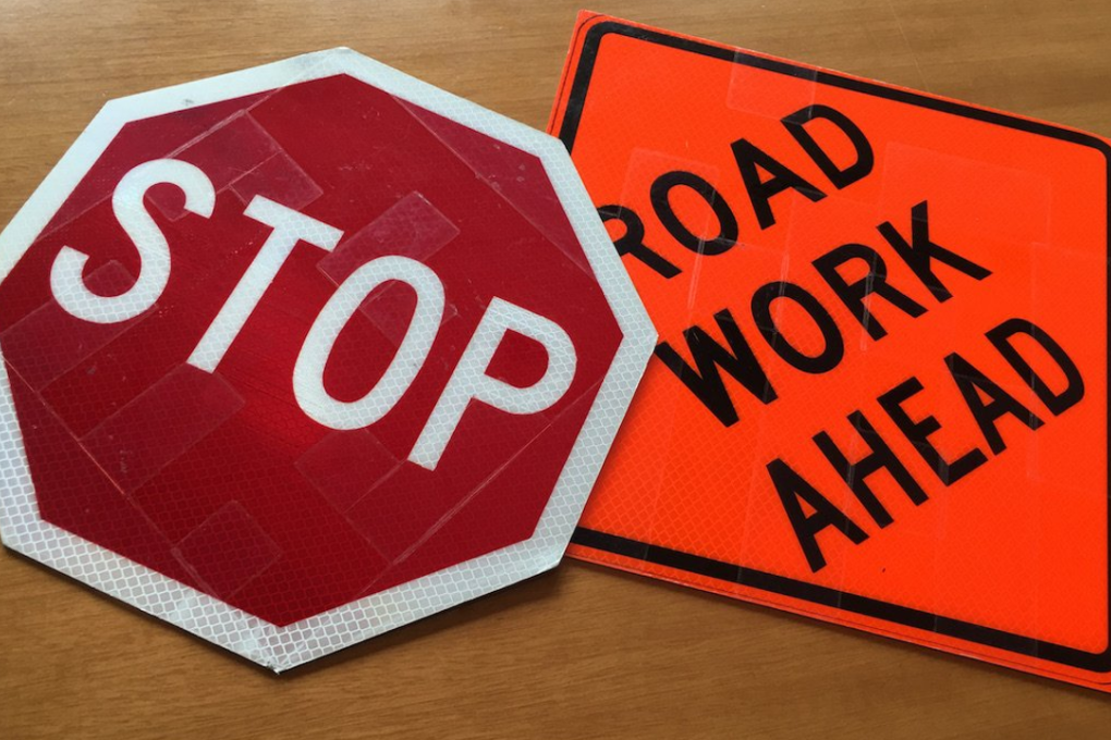 You can vaguely see the 3M's bar codes installed in these two traffic signs. Photo: Business Insider/Danielle Muoio