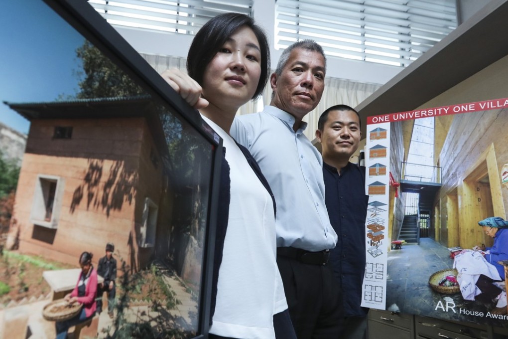 Professor Edward Ng (centre) displays pictures of the new house with colleagues Wan Li (left) and Chi Xinan. Photo: Edward Wong