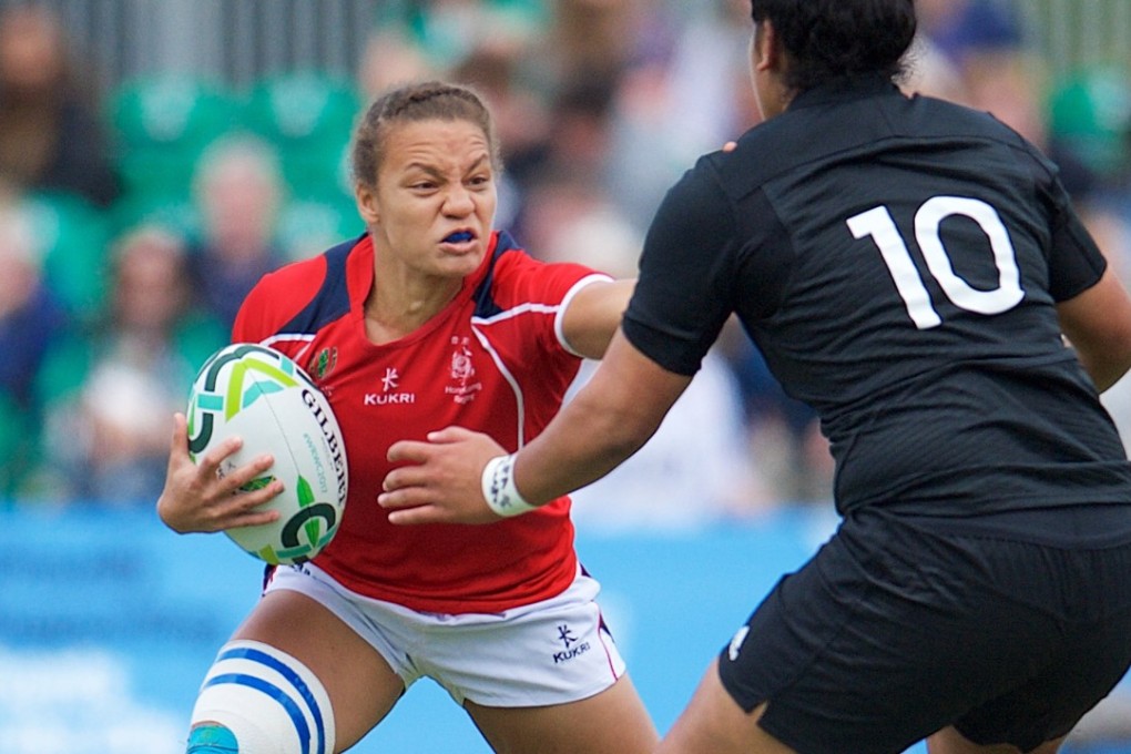 Natasha Olson-Thorne fends off New Zealand’s Victoria Subritzky-Nafatali during HongKong’s big loss at the World Cup. Photos: HKRU