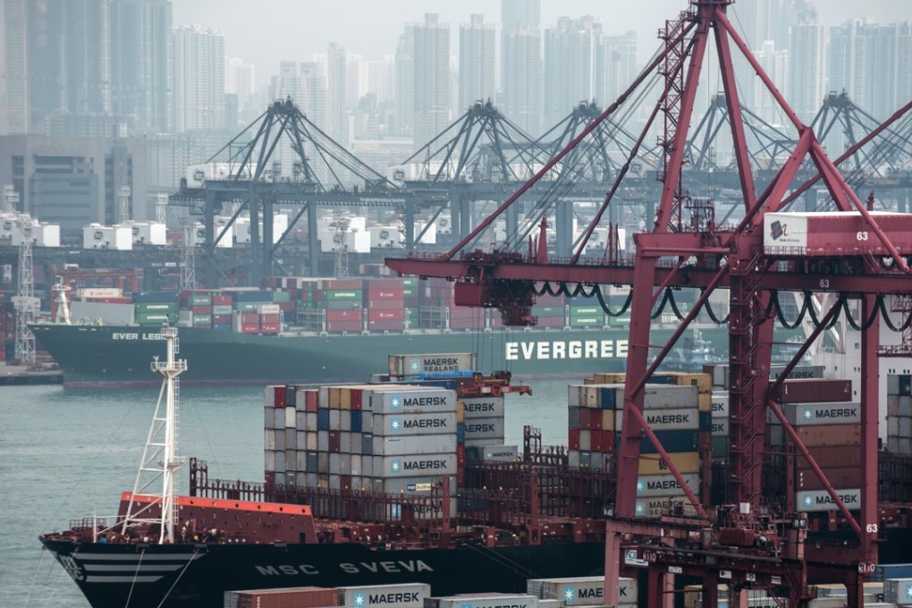 Container ships sit moored next to shipping containers and gantry cranes at the Kwai Tsing Container Terminals. Photo: Bloomberg