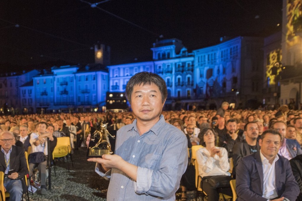 Wang Bing was the fifth Chinese director to lift the festival’s top prize. Photo: EPA