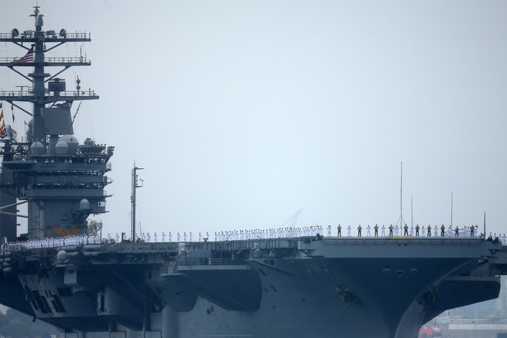 Sailors man the rails as aircraft carrier USS Nimitz as it departs for a six-month deployment in the Western Pacific from San Diego, California, on June 5. Photo: Reuters