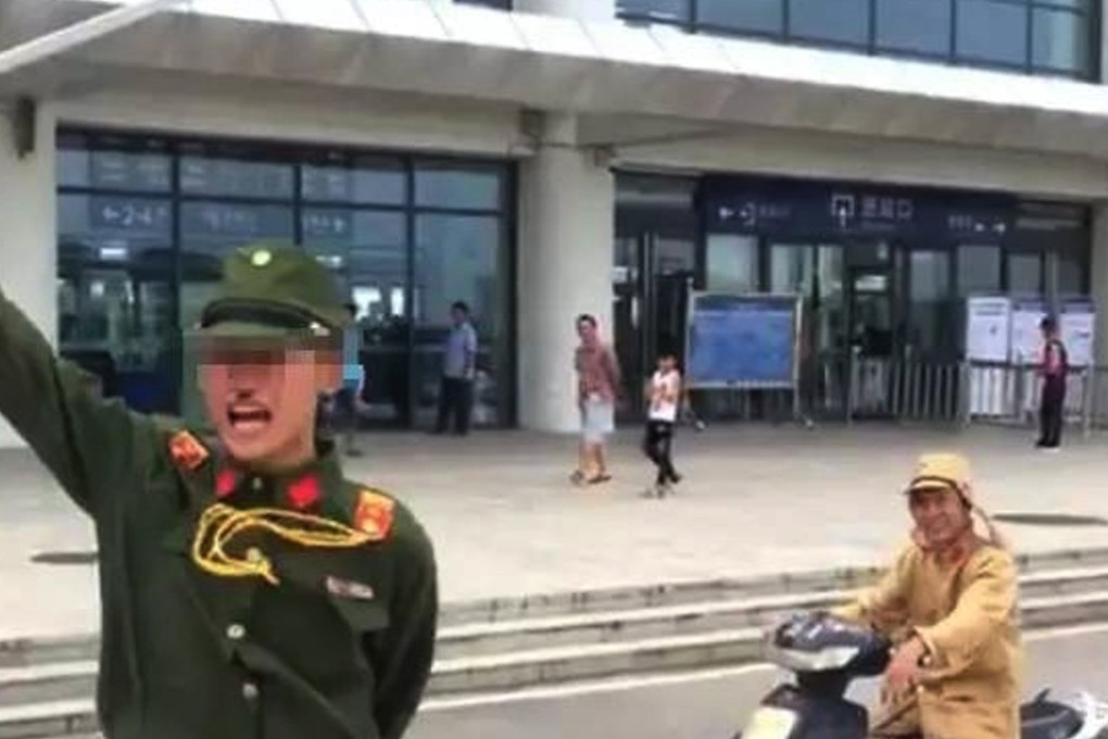 The two men in Japanese uniforms outside the railway station. Photo: Handout