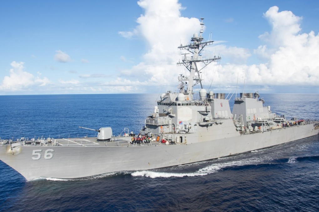 The guided-missile destroyer USS John S. McCain manoeuvres alongside the amphibious assault ship USS Bonhomme Richard (unseen) for refuelling in the Philippine Sea in June. The destroyer sailed within 12 nautical miles of the China-claimed Mischief Reef in the South China Sea on August 10. Photo: EPA / US Navy