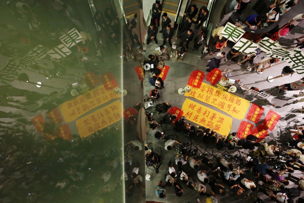 The 13 were part of a wider group who in 2014 stormed the Legislative Council over a controversial government development project. Photo: Felix Wong