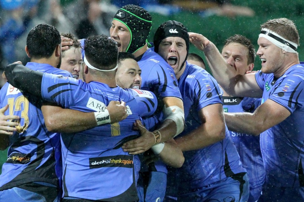 Western Force players celebrate a try. Photo: EPA