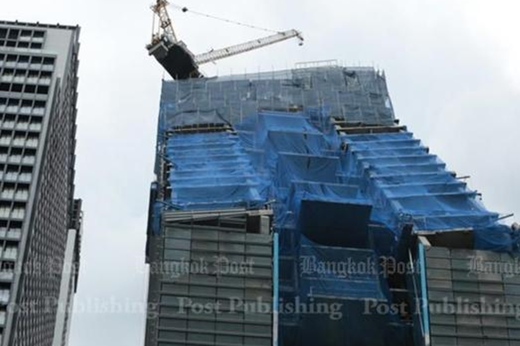 The uncovering of this new hotel building, with its unusual design, sparked fears it could be about to fall. Photo: Patipat Janthong/Bangkok Post