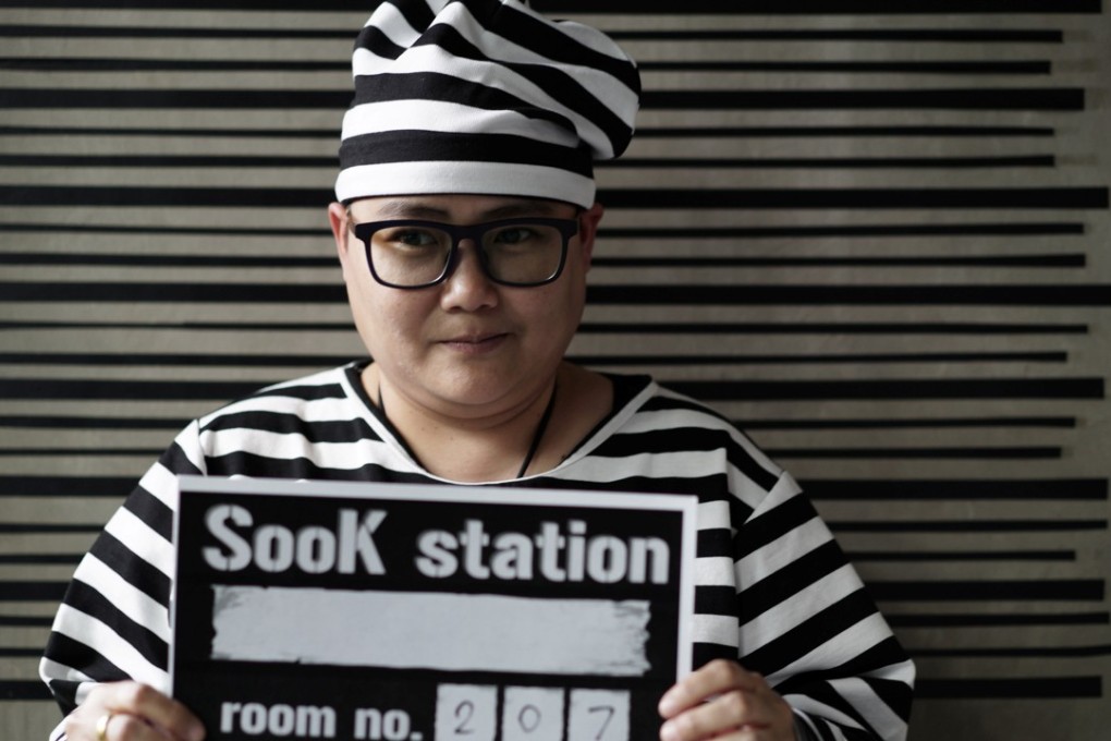 A hotel guest wears a prisoner uniform. Photo: Reuters