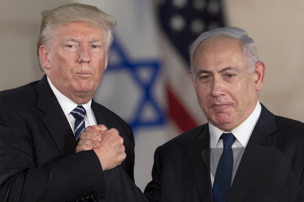FILE - In this May 23, 2017, file photo, U.S. President Donald Trump and Israeli Prime Minister Benjamin Netanyahu shake hands at the Israel museum in Jerusalem. Netanyahu came under mounting pressure Thursday to speak out against President Donald Trump's response to the racially charged violence and anti-Semitic outpouring in Charlottesville, Virginia. Netanyahu's near silence on the march staged by anti-Semitic white nationalists and Trump's assertion that "both sides" were responsible for the violence appears to reflect the Israeli leader's desire to remain in the good graces of the embattled U.S. president. (AP Photo/Sebastian Scheiner, File)