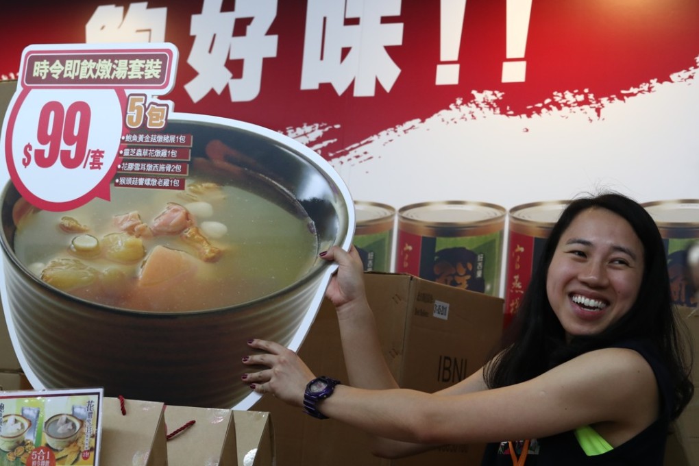 An exhibitor gets ready for the opening of the Hong Kong Food Expo on Thursday. Photo: Nora Tam