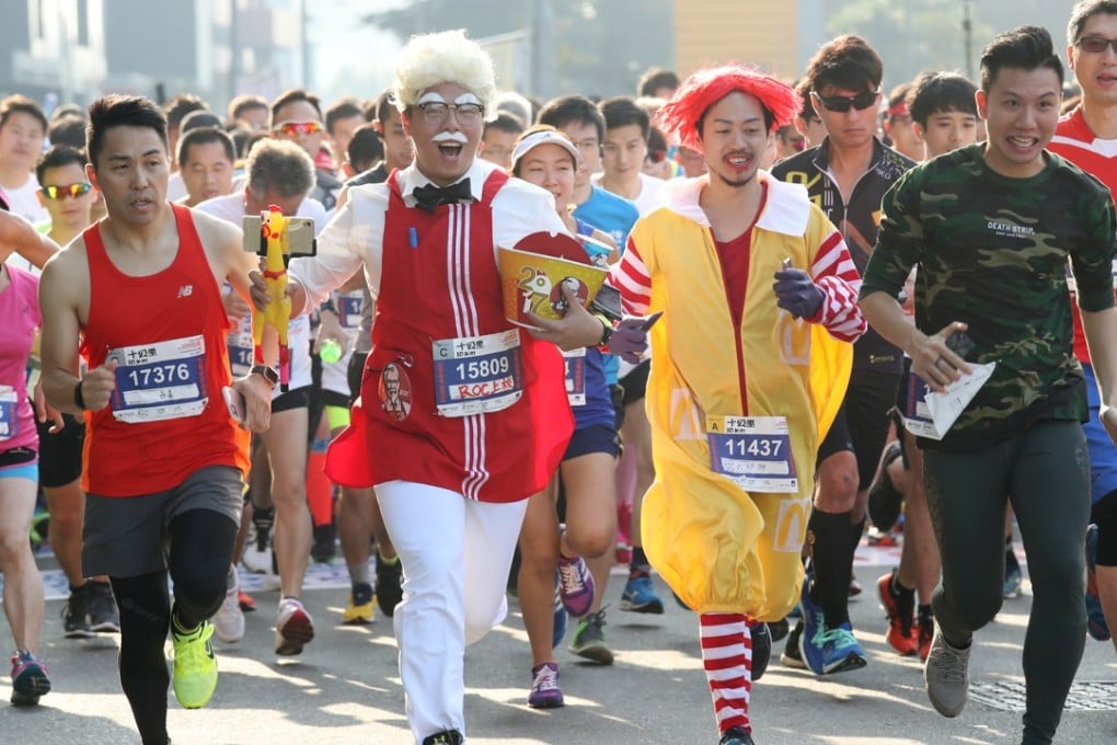 Participants compete in a streetathon in Kwun Tong organised by RunOurCity, a group that promotes street running, on January 8. But their beer run, slated for November, raised safety concerns. Photo: Nora Tam