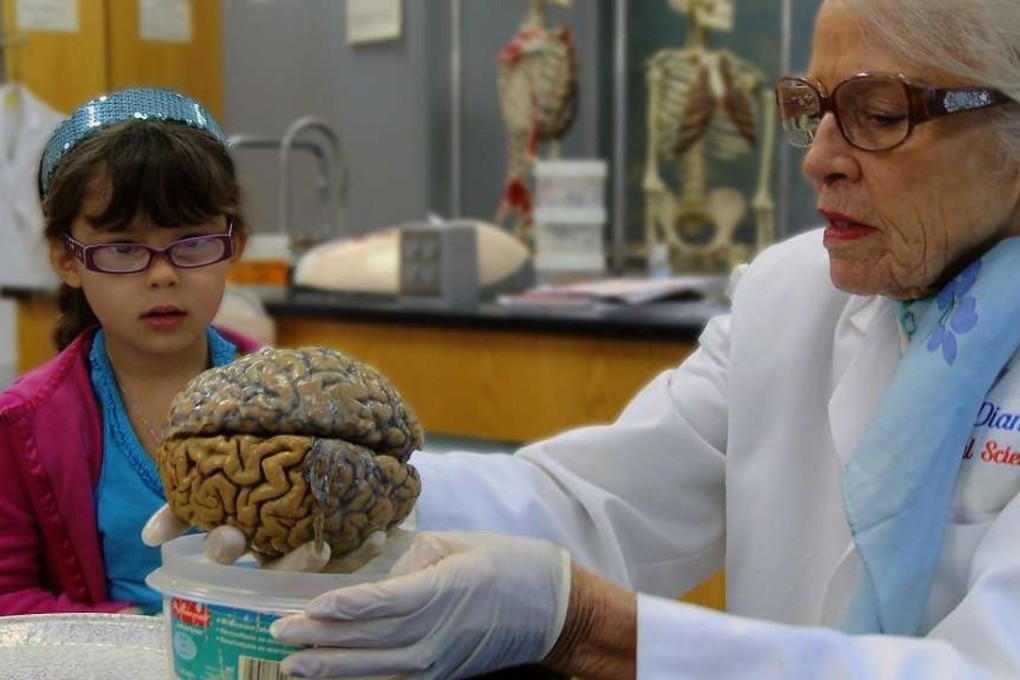 Marian Cleeves Diamond with a young visitor to her lab. Photo: Facebook