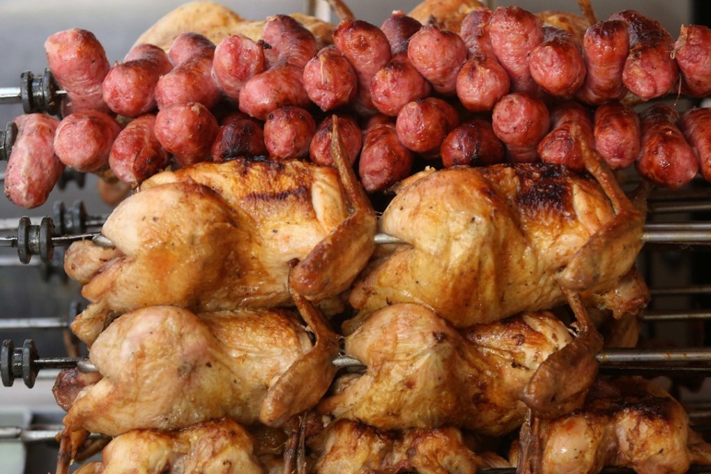 Chickens and sausages on display at a steakhouse in Rio de Janeiro. Photo: EPA