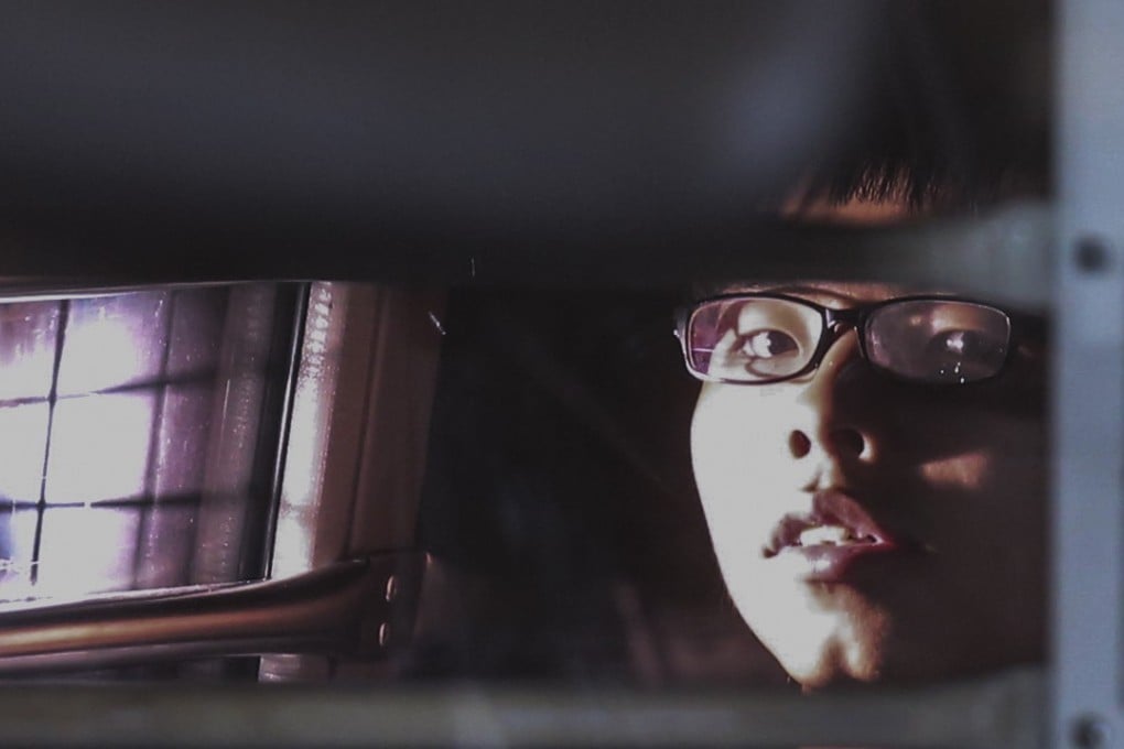 Joshua Wong escorted by police leaving the High Court on Thursday. Photo: K. Y. Cheng