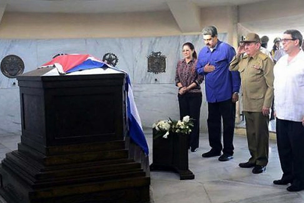 Venezuelan first lady Cilia Flores (left), Venezuelan President Nicolas Maduro, Cuban President Raul Castro, and Cuban Foreign Affairs Minister Bruno Rodriguez pay their respects at the tomb of Cuba’s former leader Fidel Castro in Santa Ifigenia cemetery in Santiago on Tuesday. Photo: AFP