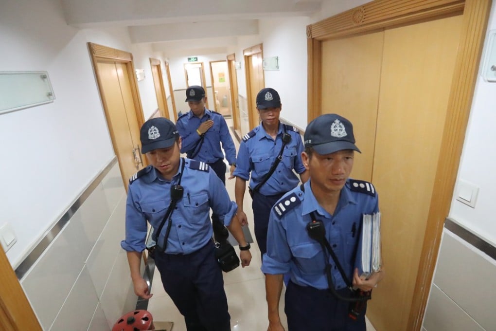 Personnel from Fire Services Department investigating at Mai Sik Industrial Building in Kwai Chung. A fire at the old industrial building killed three people on August 12. Photo: Edward Wong