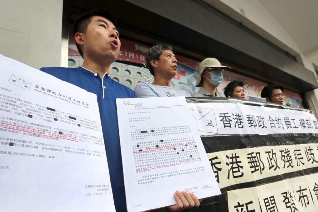 Hongkong Post employees hold a protest outside the General Post Office in Central. Photo: Edward Wong