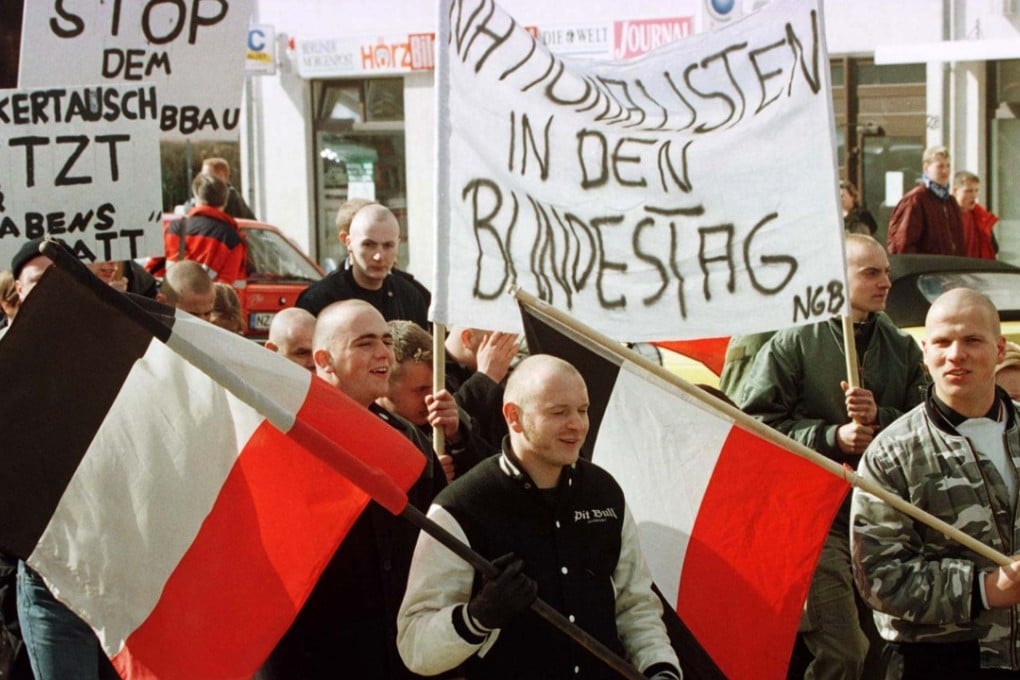 German neo-Nazis carry nationalistic flags and banners during a demonstration for more work for native Germans in the city of Neustrelitz in Germany's northeast state of Mecklenburg-Vorpommern. Neo-Nazis can march in Germany, but they face strict, tough rules by the police. Photo: Reuters