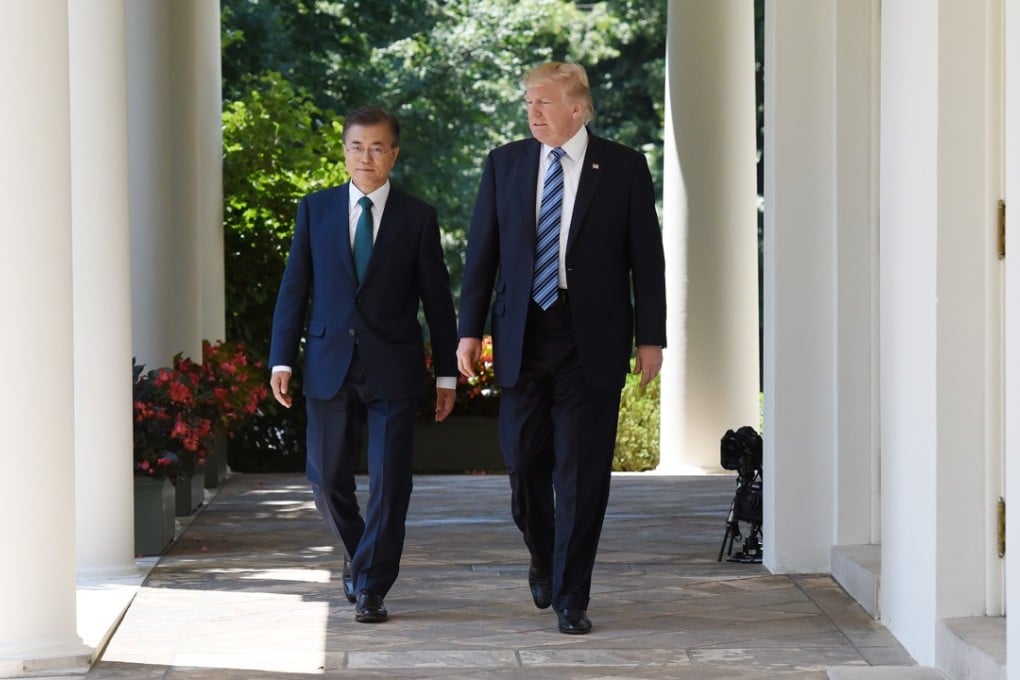 US President Donald Trump, right, and Moon Jae-in, South Korea's president, walk through the Colonnade of the White House in Washington on June 30. Photo: Bloomberg