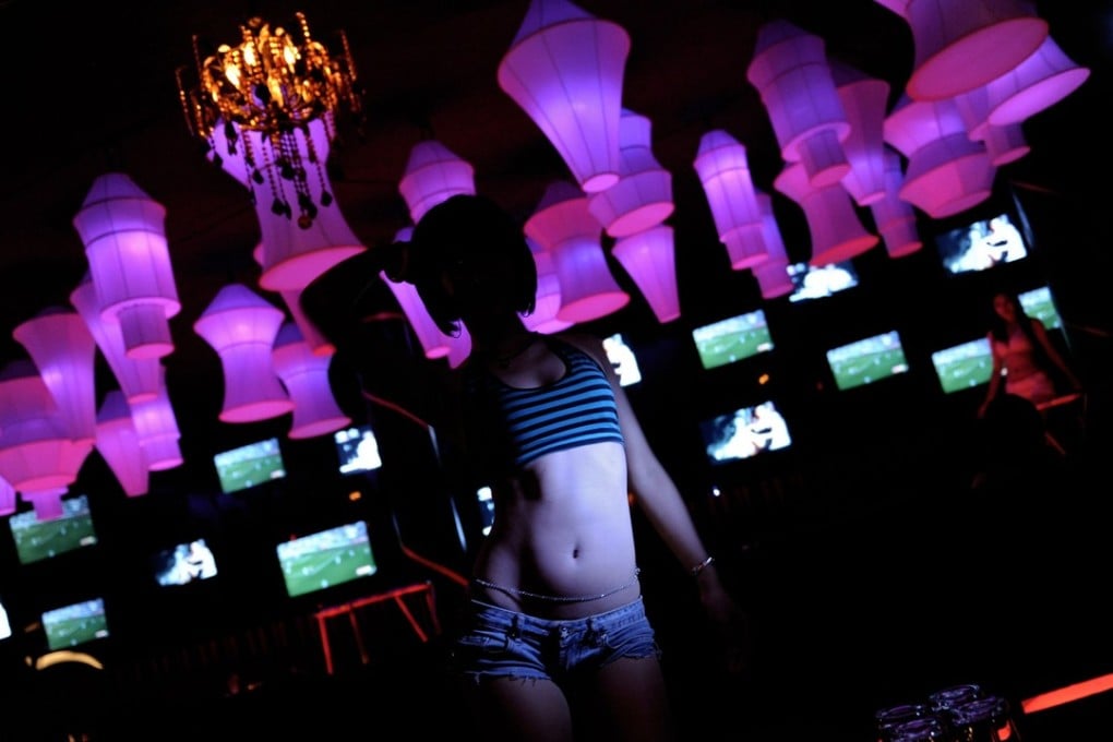 A girl dances in a club in the red light district in Pattaya in 2009. Photo: AFP