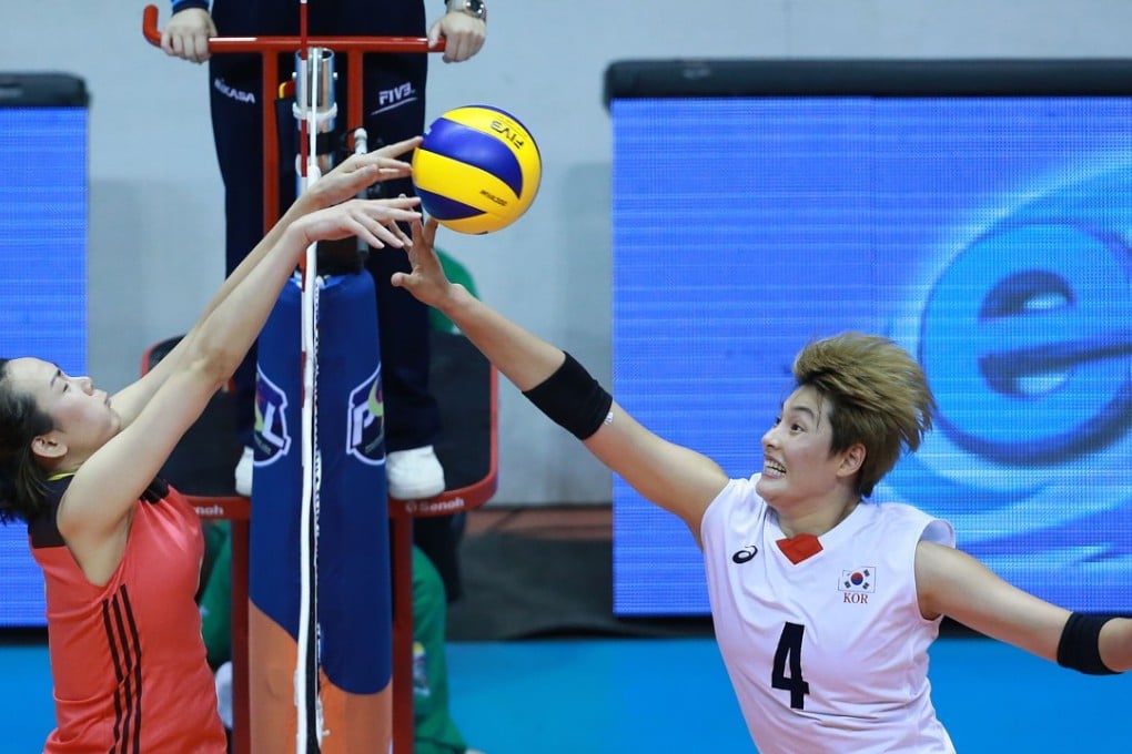 China’s Liu Mengya tries to block South Korea’s Kim Hee-jin’s spike during the team’s play-off match for third place at the Asian senior women’s volleyball championships in Laguna province. Photos: Xinhua
