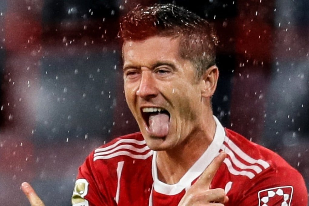 Robert Lewandowski celebrates after scoring from the penalty spot against Bayer Leverkusen in Munich. Photo: EPA